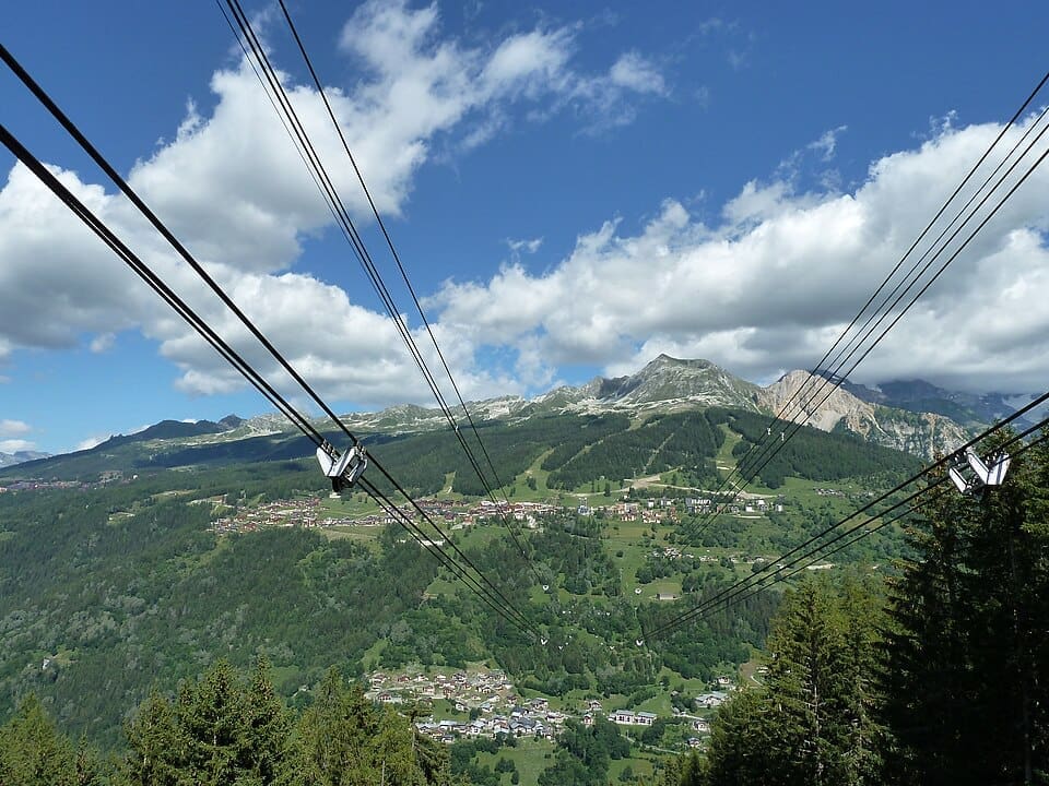 The Vanoise Express cable car crossing the valley between Les Coches and Peisey-Vallandry in the Paradiski ski area.