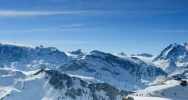 Blue sky and white peaks in the Alps