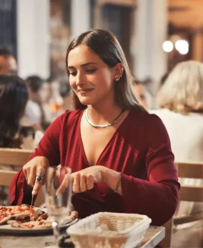 A woman eats dinner in an Alpine restaurant