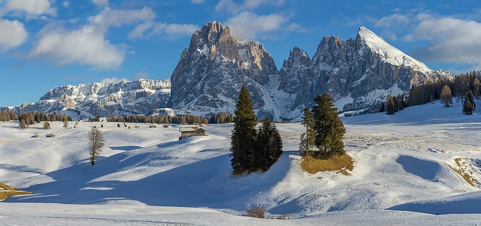 Sassolungo mountain group viewed from the Alpe di Siusi plateau in winter