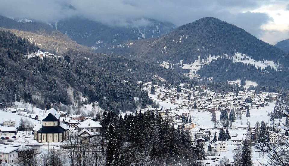 View of Falcade village surrounded by the Dolomite mountains