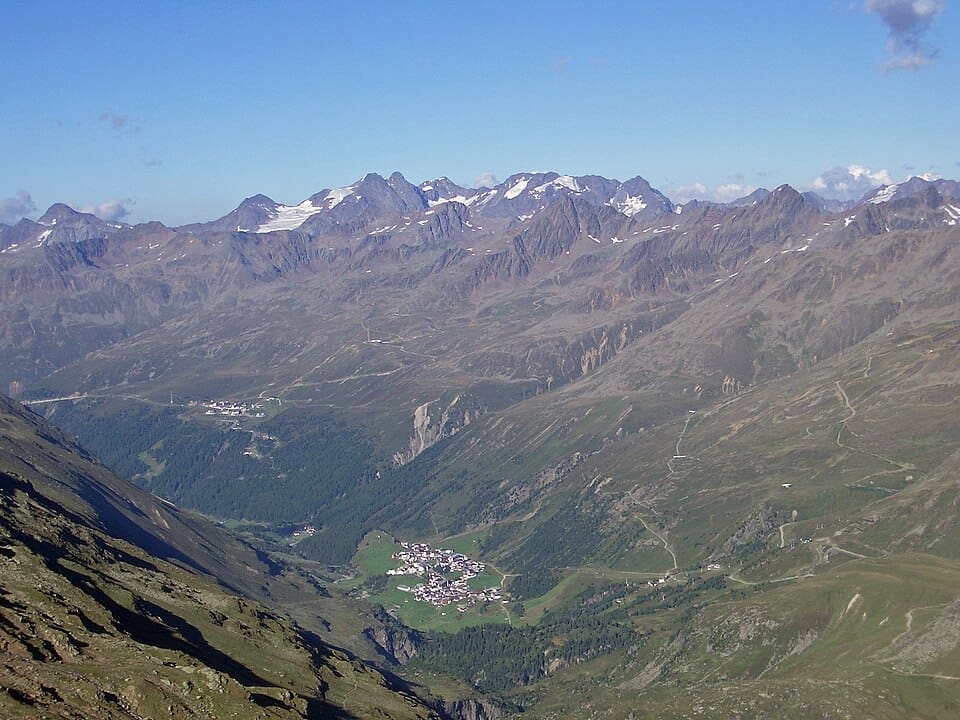 Wide landscape view of the Gurgler Tal valley featuring snow-capped peaks of the Stubai Alps