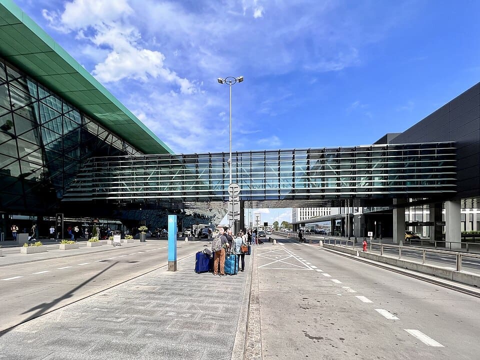 Exterior view of the modern glass terminal at Kraków Airport