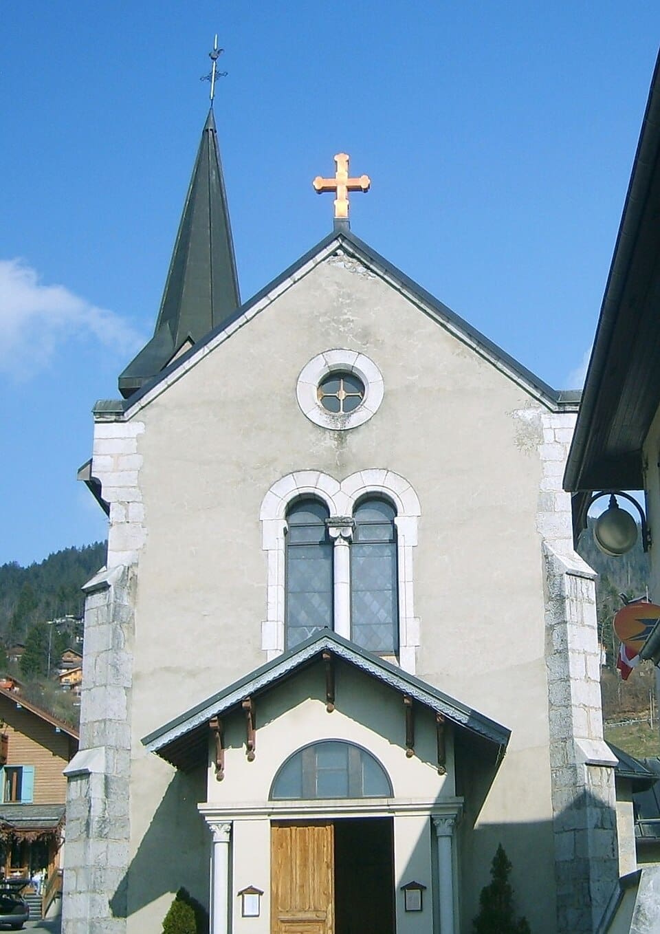 View of Saint-Jean-de-Sixt village church and surrounding chalets