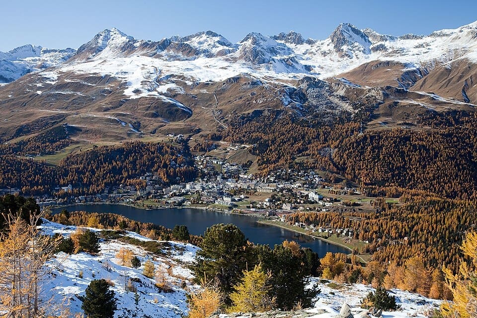 View of St. Moritz and its lake from Muottas da Schlarigna, featuring Piz Nair